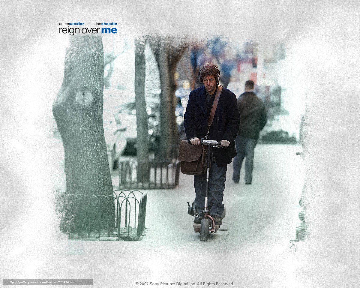 man riding scooter on sidewalk
