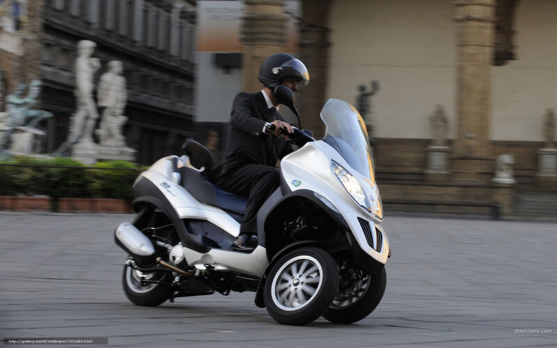 Man Riding Scooter — Silver, Dynamic, Afternoon, Photograph