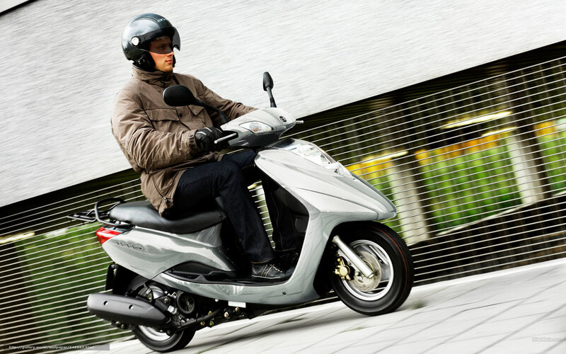 Man Riding Scooter — Silver, Dynamic, Photograph