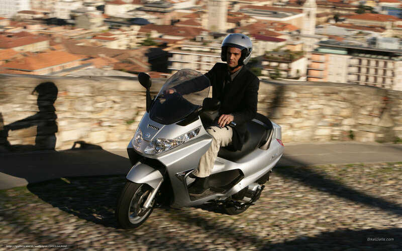 Man Riding Scooter — Silver