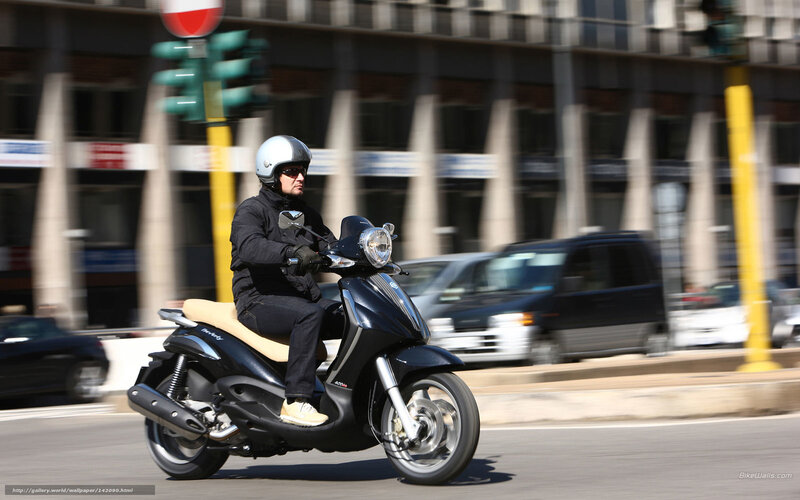 Man Riding Scooter
