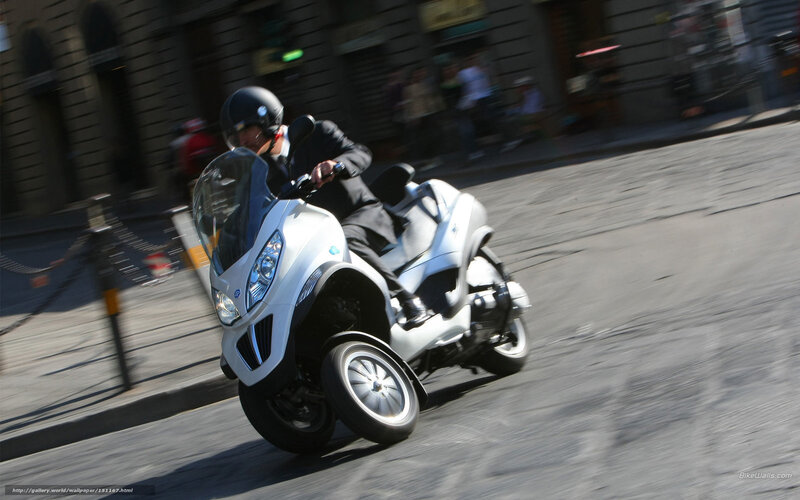 Man Riding Scooter — White, Dynamic, Afternoon