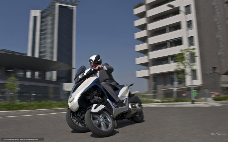 Man Riding Three-wheeled Scooter — White, Dynamic, Afternoon