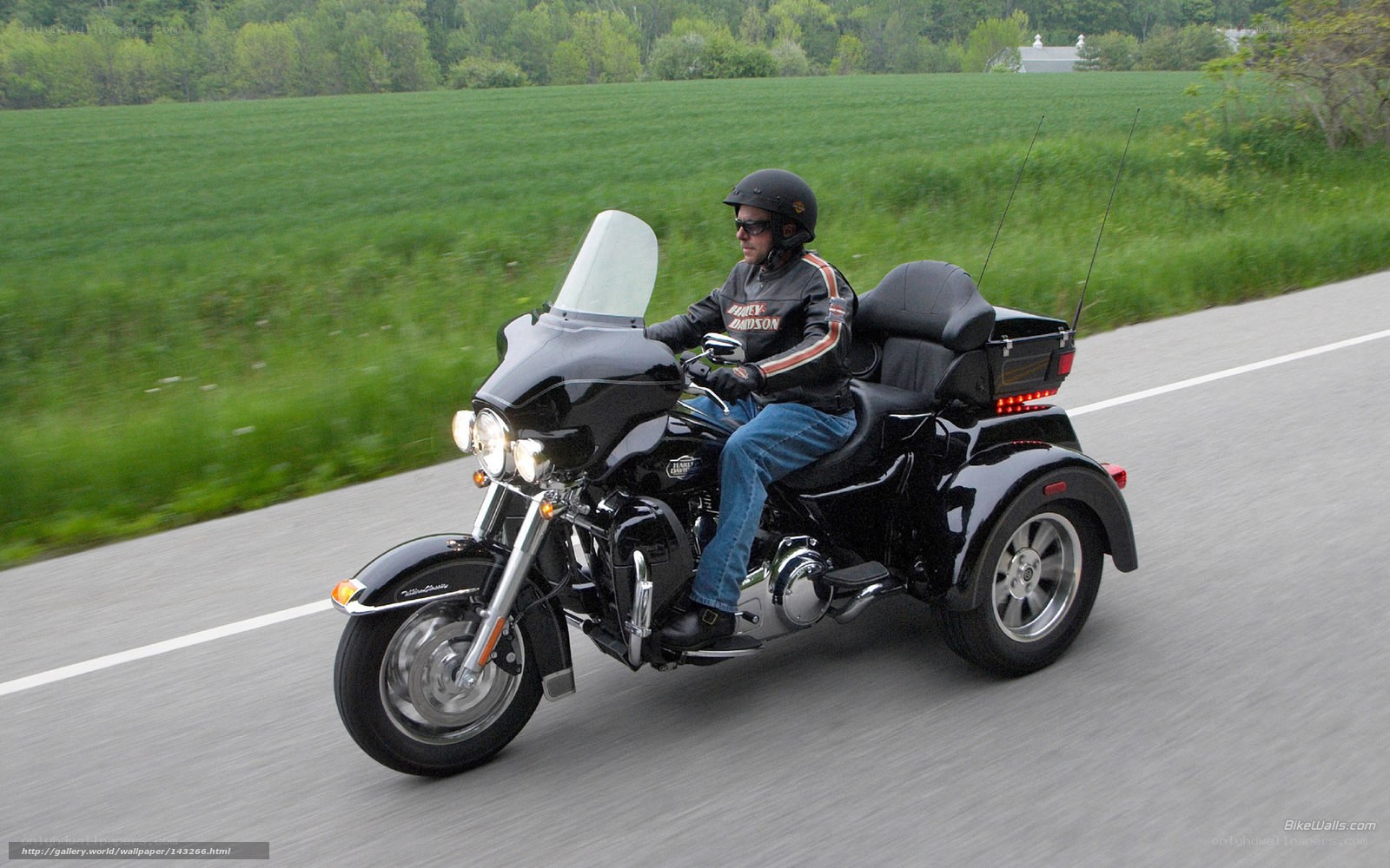 man riding trike on road