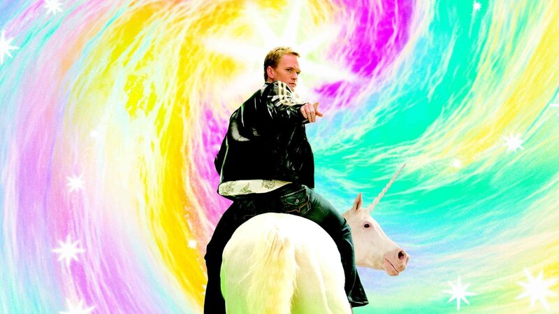 man riding unicorn in rainbow