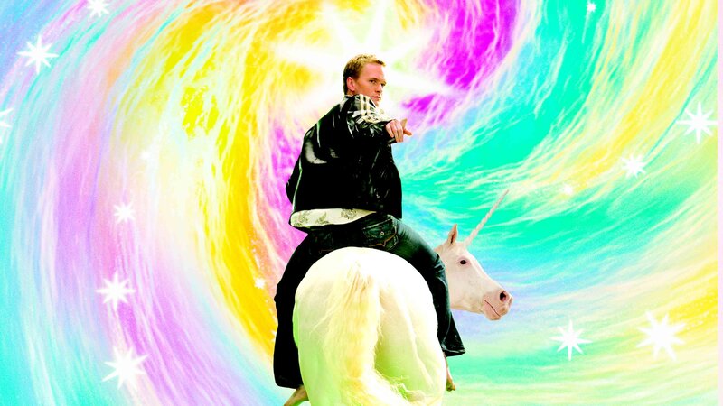 man riding unicorn in rainbow