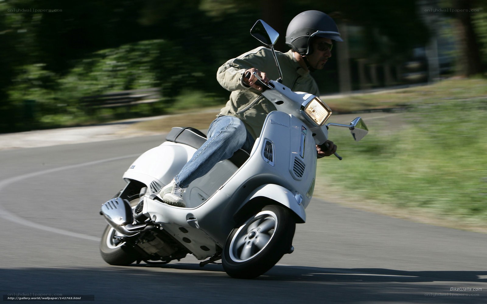 Man riding white scooter