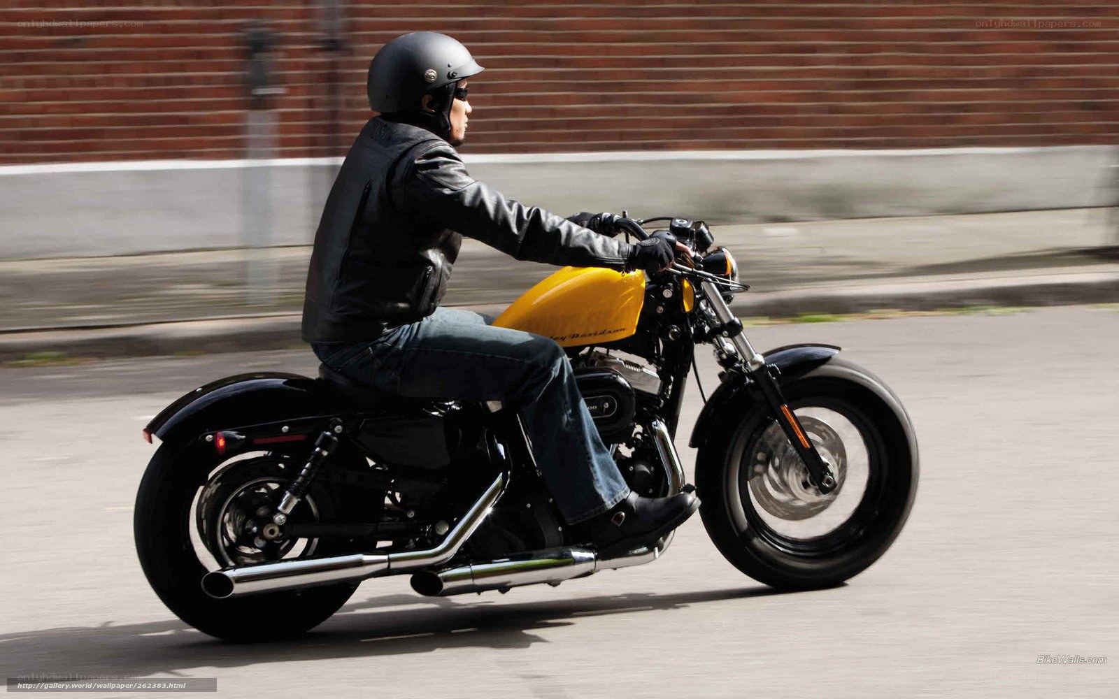 man riding yellow motorcycle