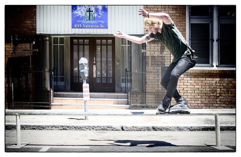 Man rollerblading on a curb