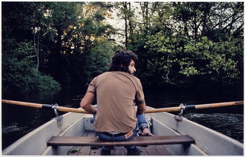 Man rowing a boat on a river