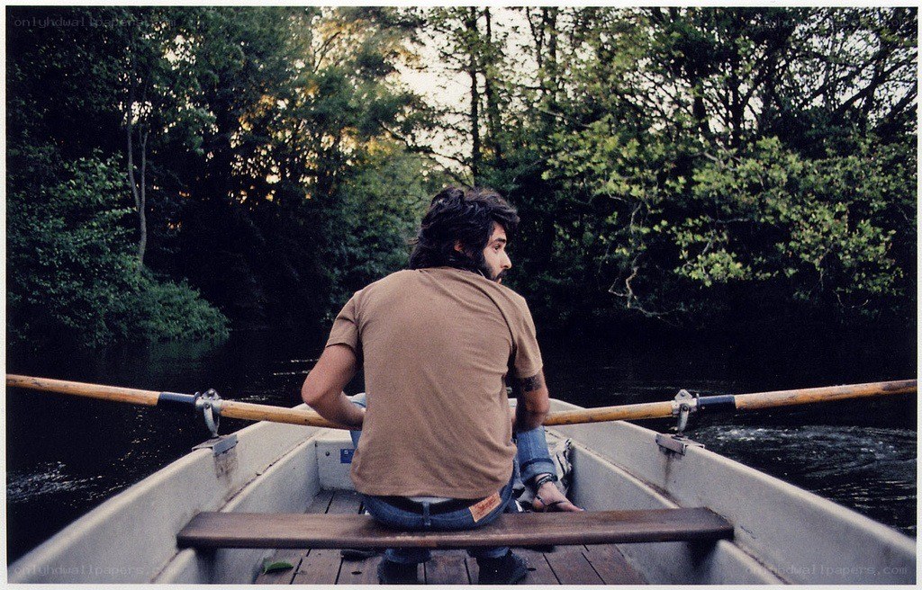 Man rowing a boat on a river