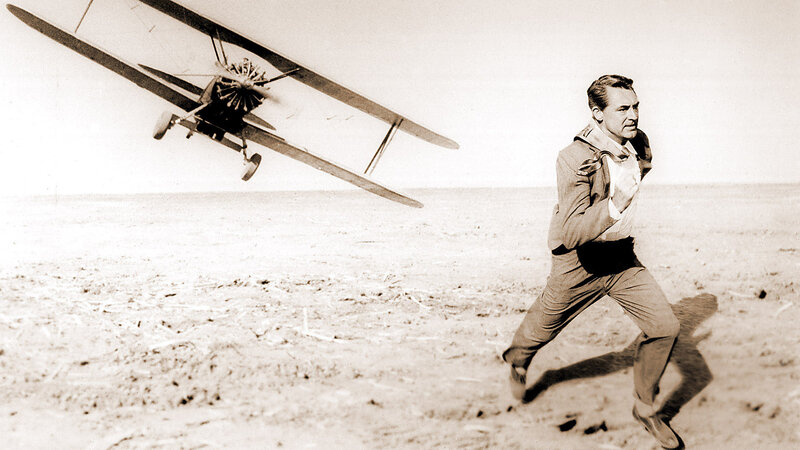 Man running from biplane