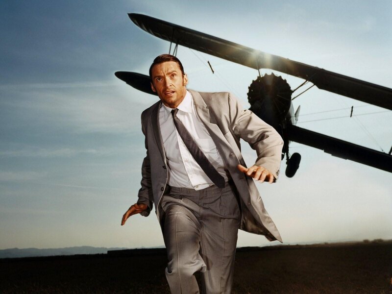 Man running from biplane