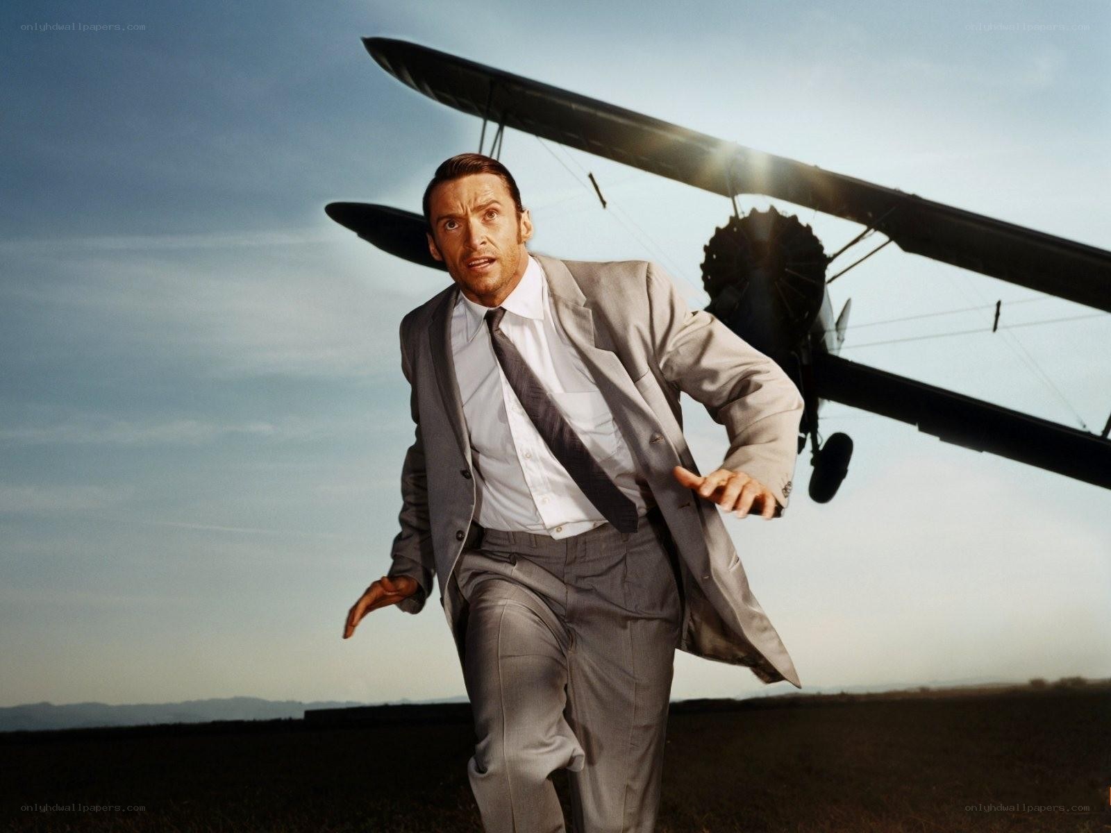 Man running from biplane