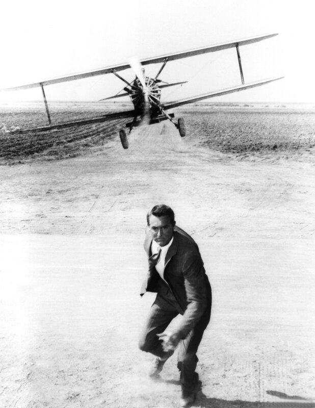 Man running from biplane