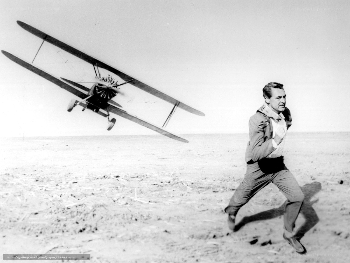 man running from biplane