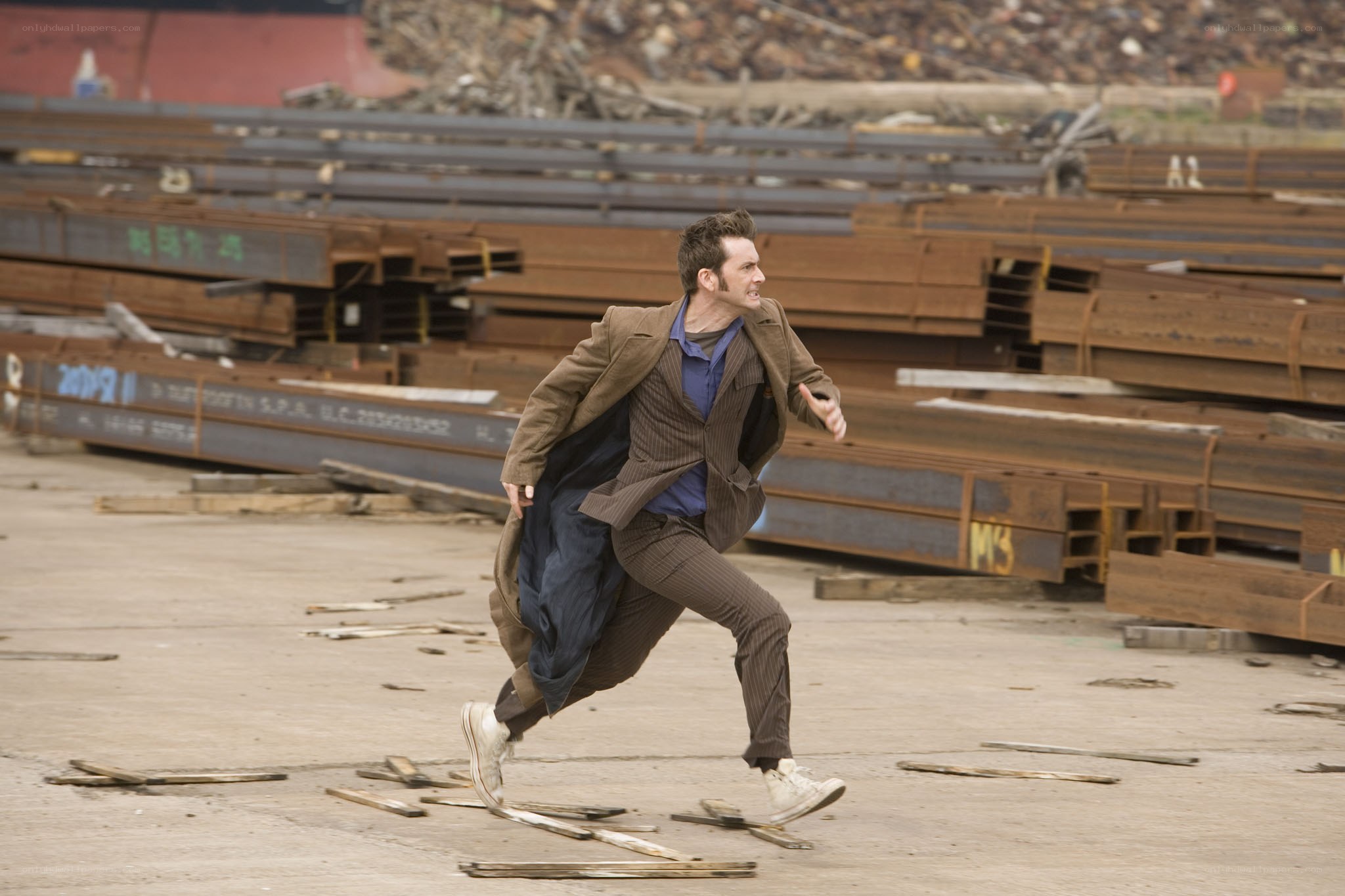 man running in industrial yard