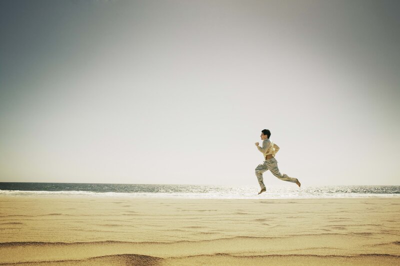 Man Running on Beach — Sand