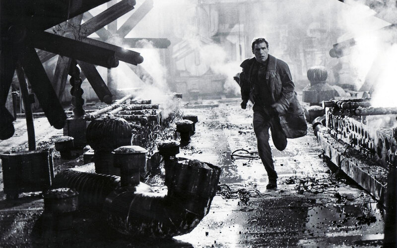 man running through industrial ruin