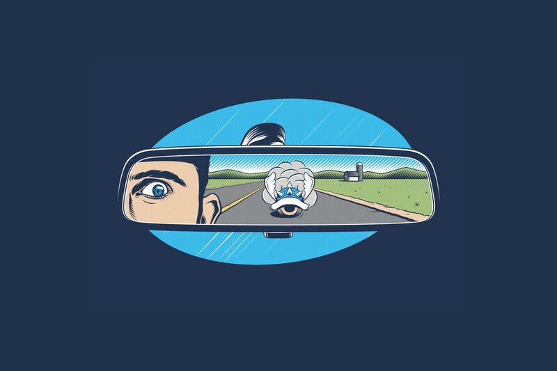 Man's Eye in Rearview Mirror