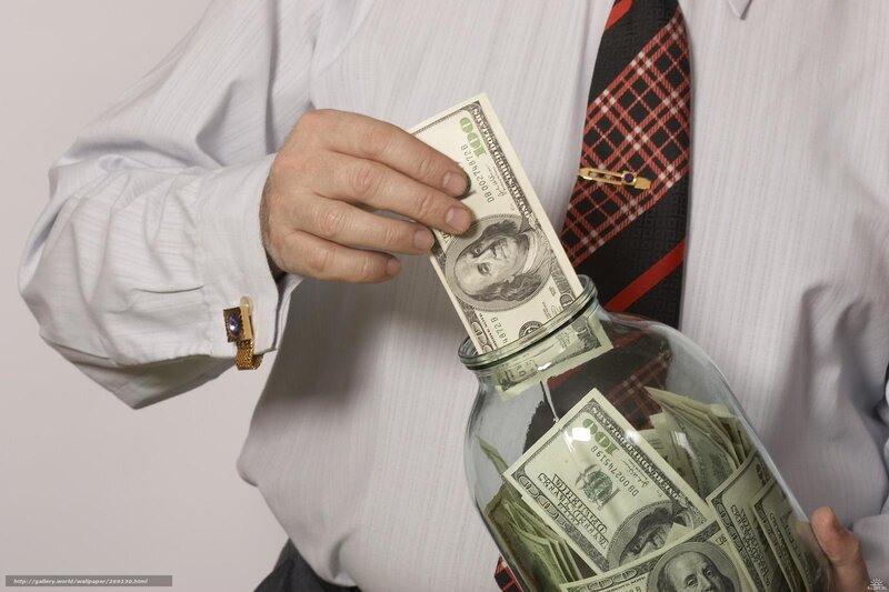 man saving money in jar
