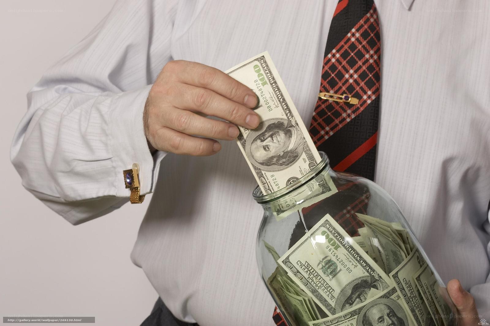 man saving money in jar