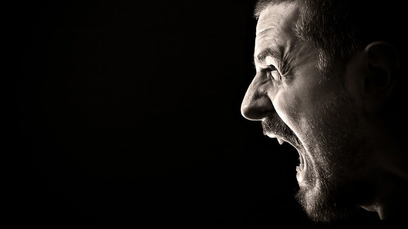 man screaming in profile