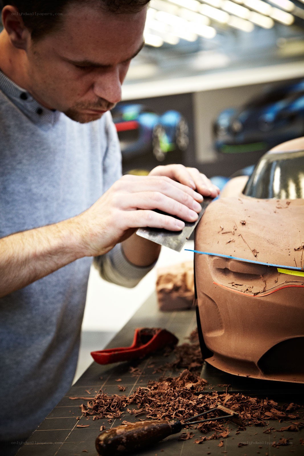 man sculpting car model