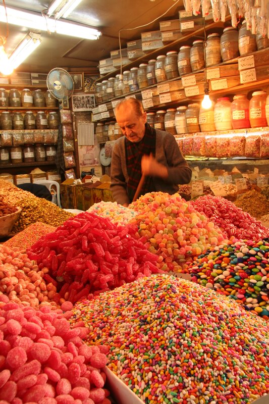 Man selling candies in a market