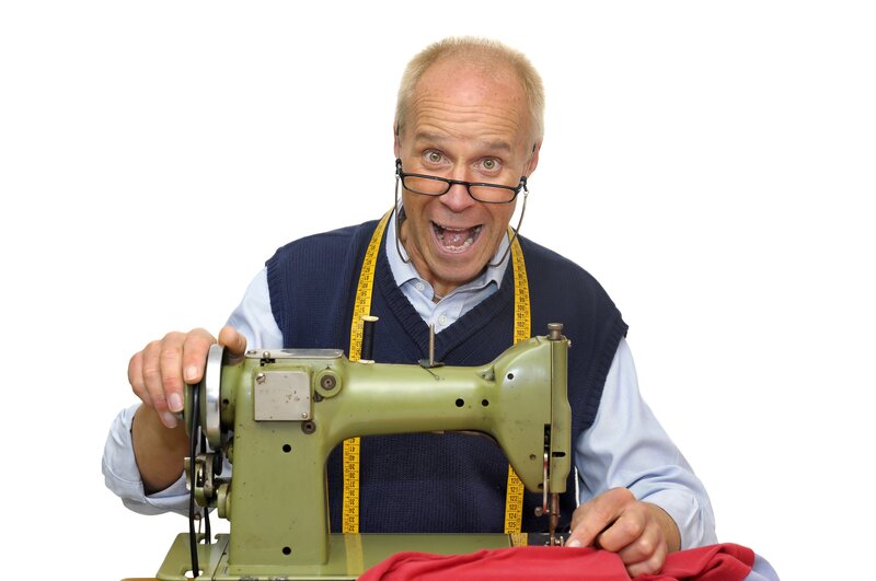man sewing with sewing machine