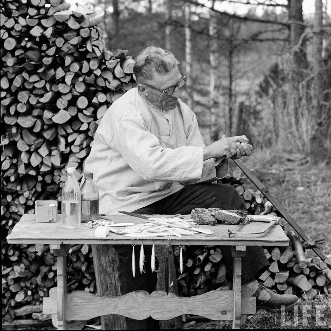 Man sharpening fishing lures
