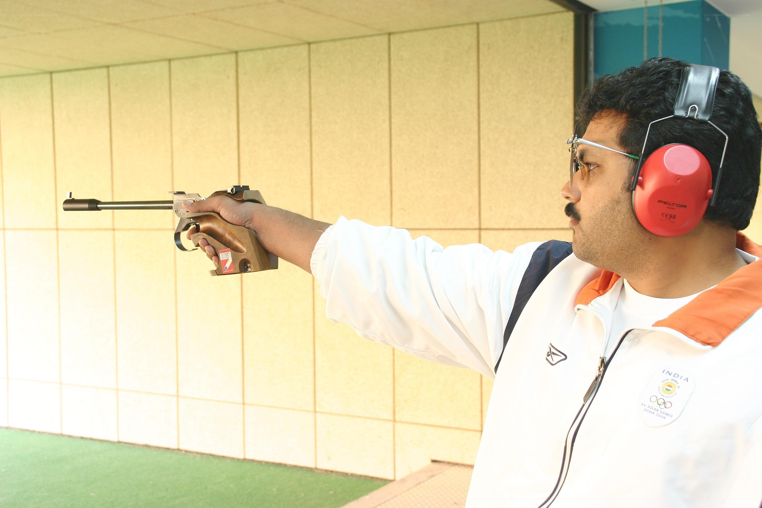 man shooting a pistol