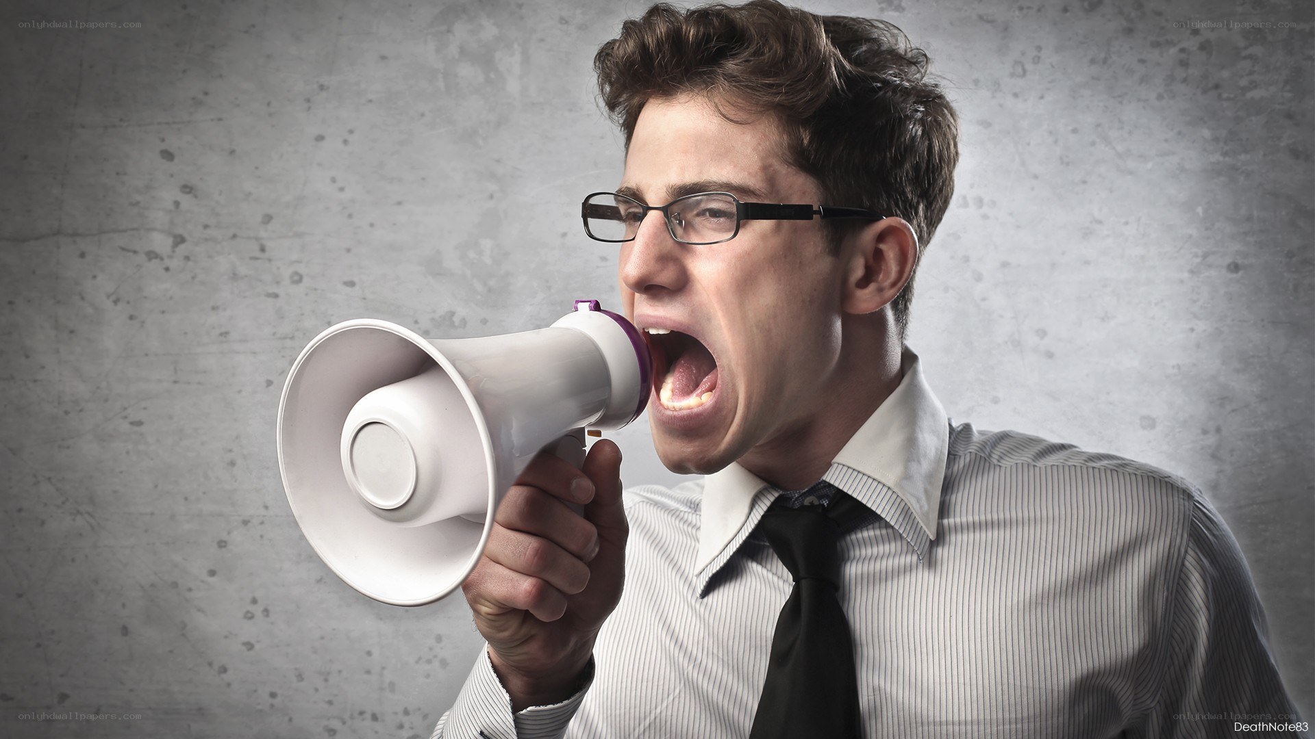 man shouting into megaphone