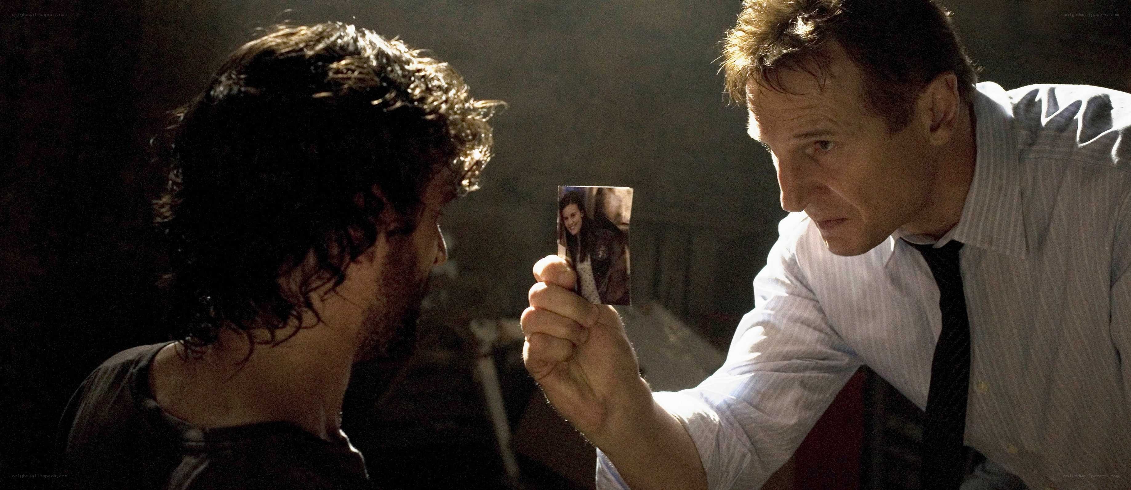 man shows photo to another man