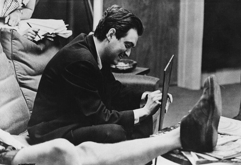 Man signing a photo