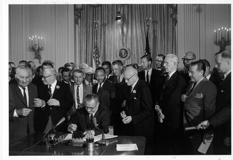 Man Signing Document