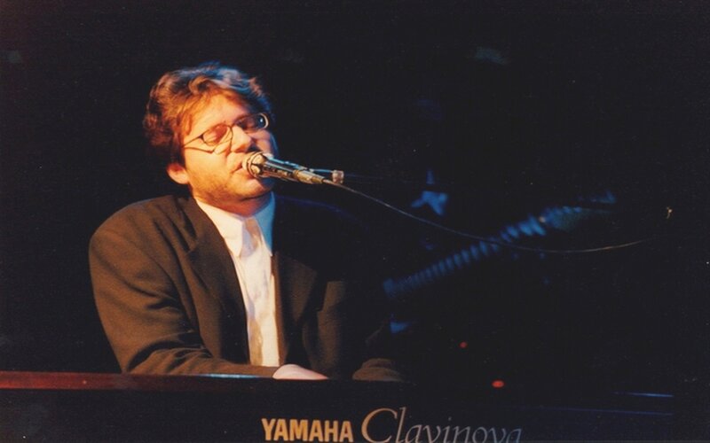Man Singing at Piano — Black, Intense