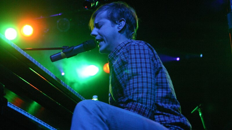 Man Singing at Piano — Green