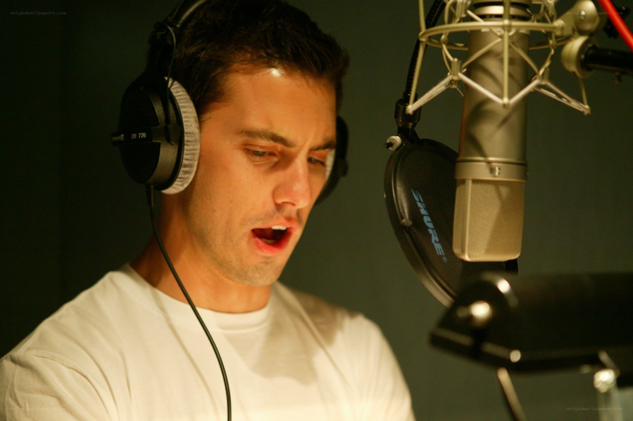 man singing in recording studio