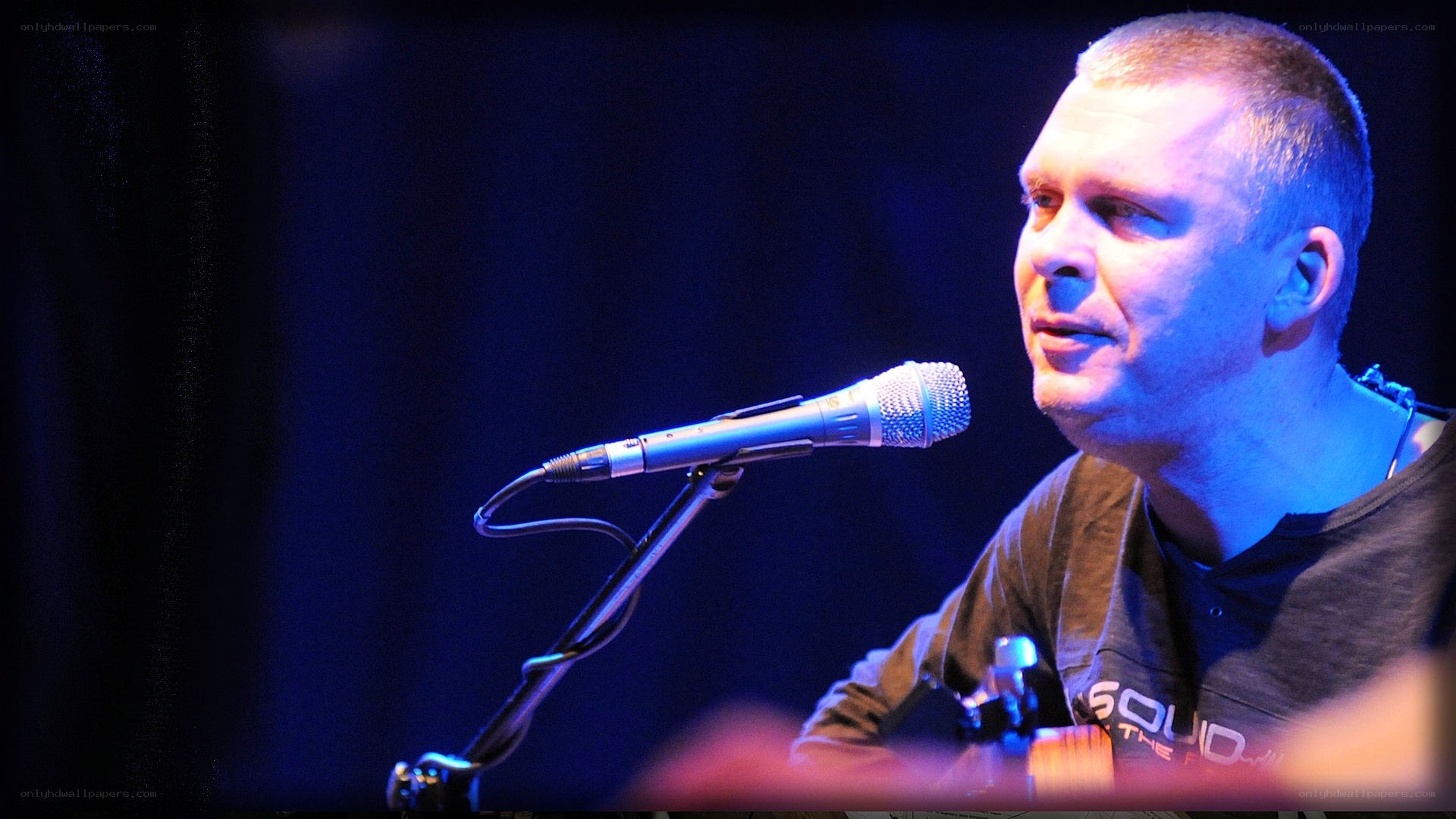 man singing into microphone