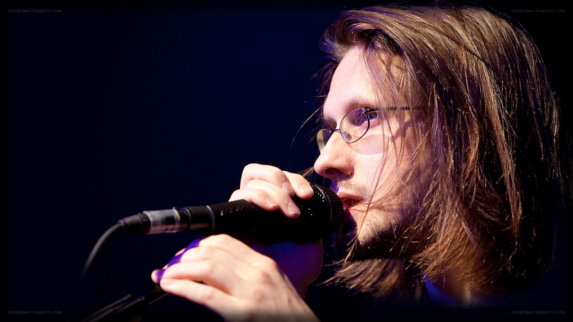 man singing into microphone