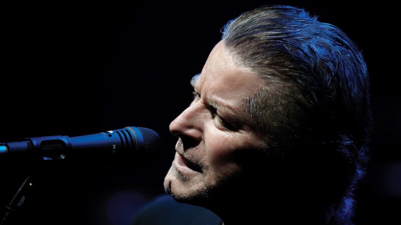 man singing into microphone