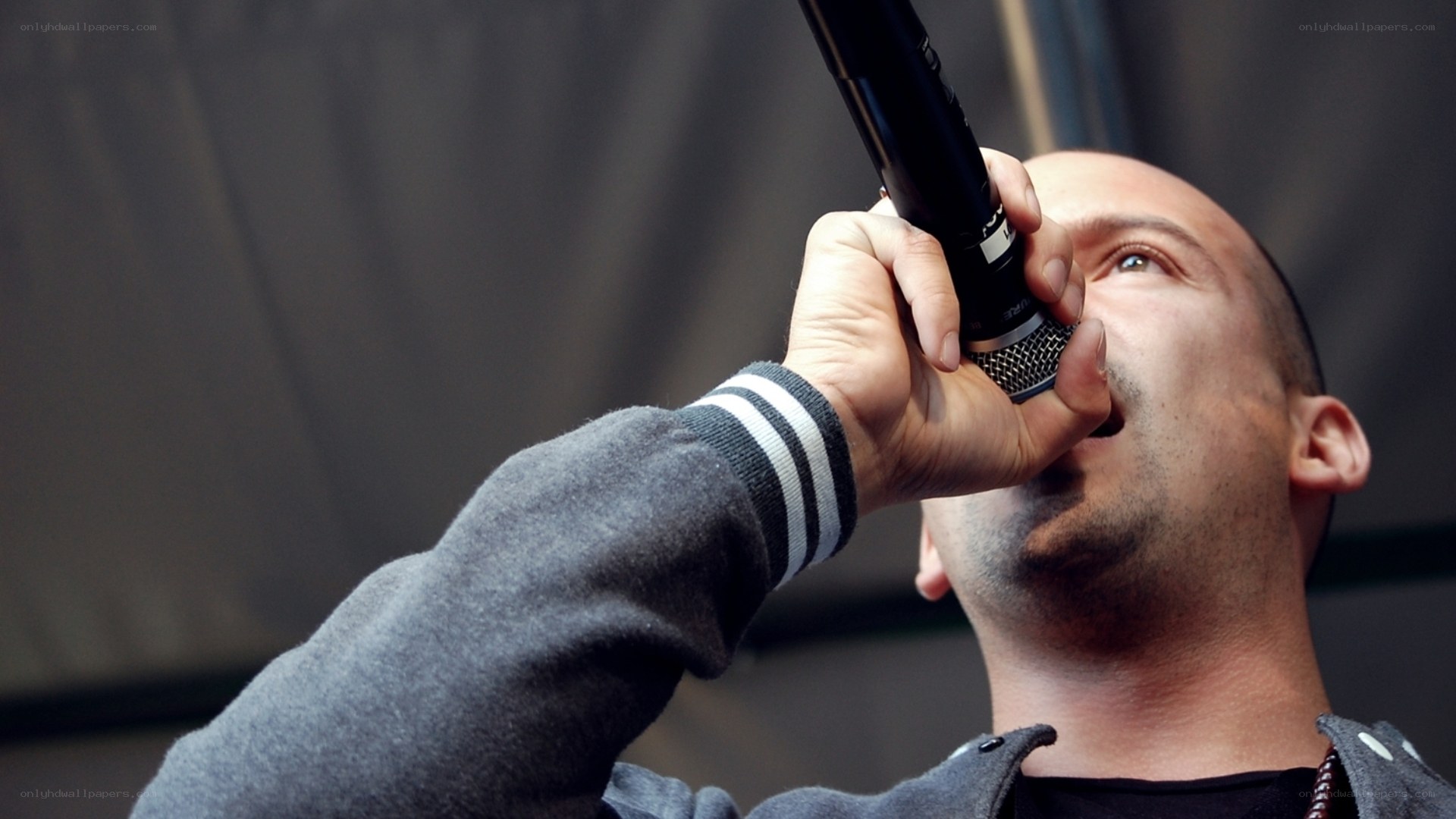 man singing into microphone