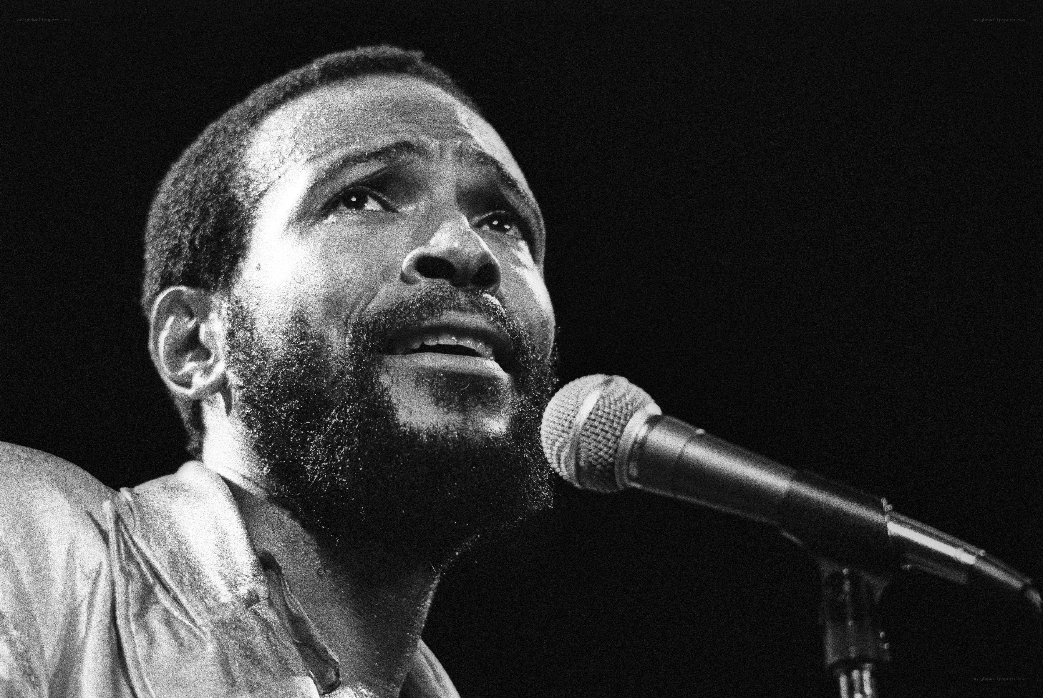 man singing into microphone