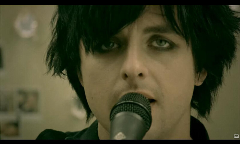 man singing into microphone