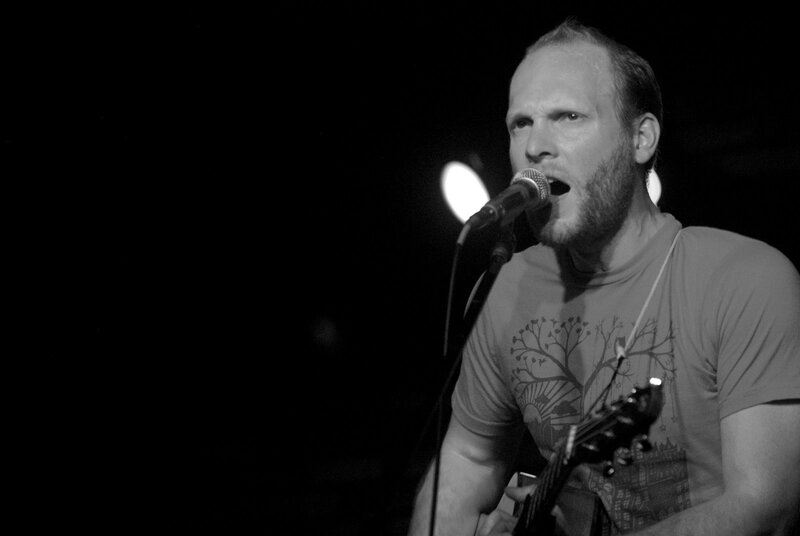 man singing into microphone