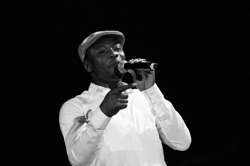 man singing into microphone