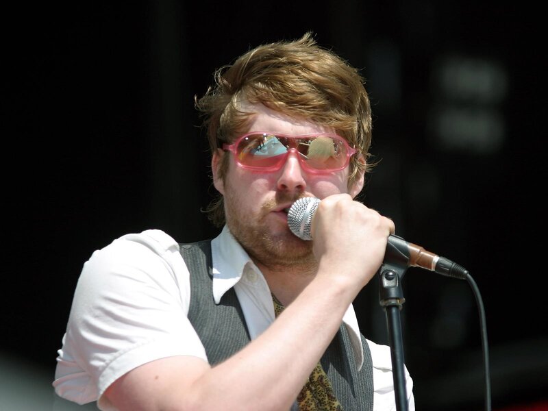 man singing into microphone