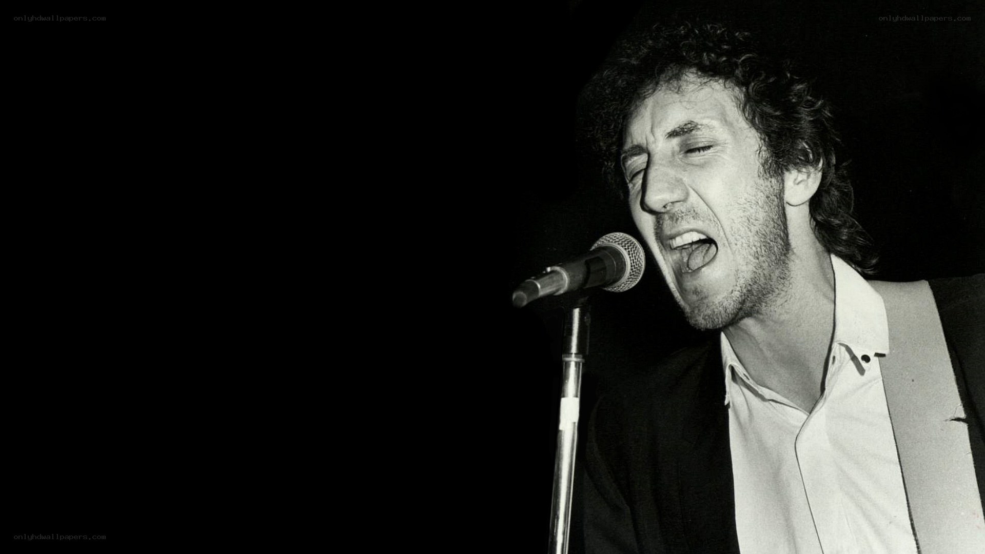 man singing into microphone