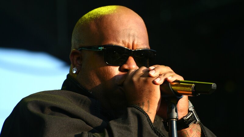 Man Singing into Microphone — Black, Dramatic, Afternoon